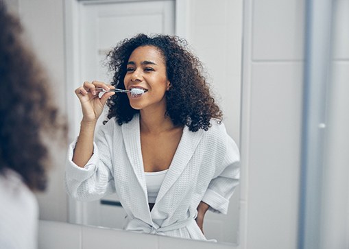 Woman brushing her teeth