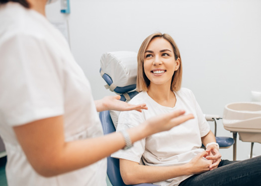 Woman talking to orthodontist