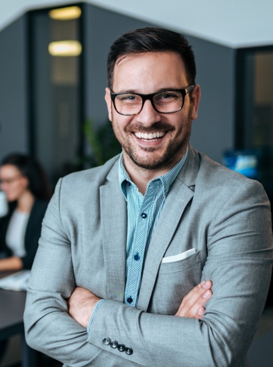 Man smiling in business attire