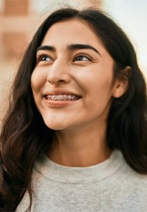 Teen with braces smiling