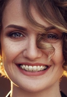 Woman with braces smiling