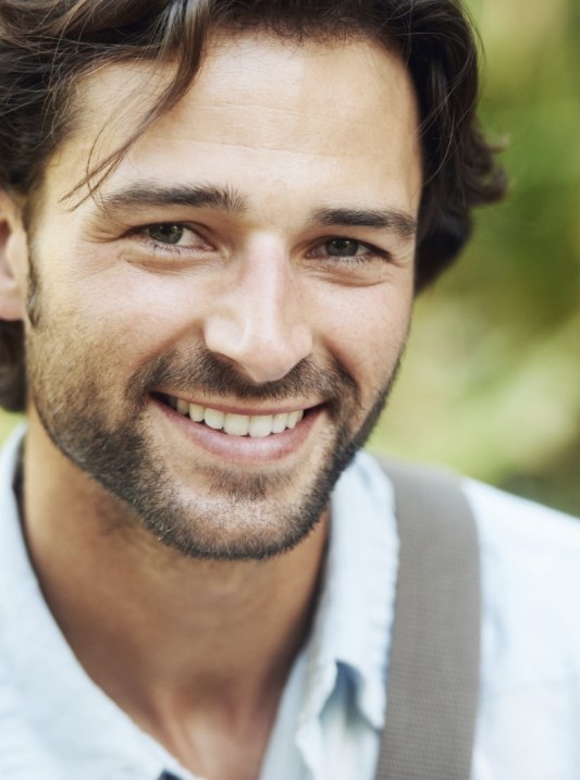 Man smiling outdoors