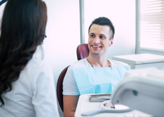 Dental professional talking to patient about in house lab