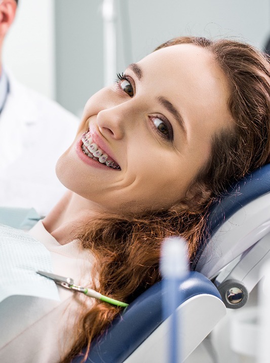 Young woman getting braces