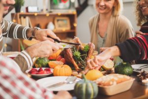 family and friends enjoying holiday foods