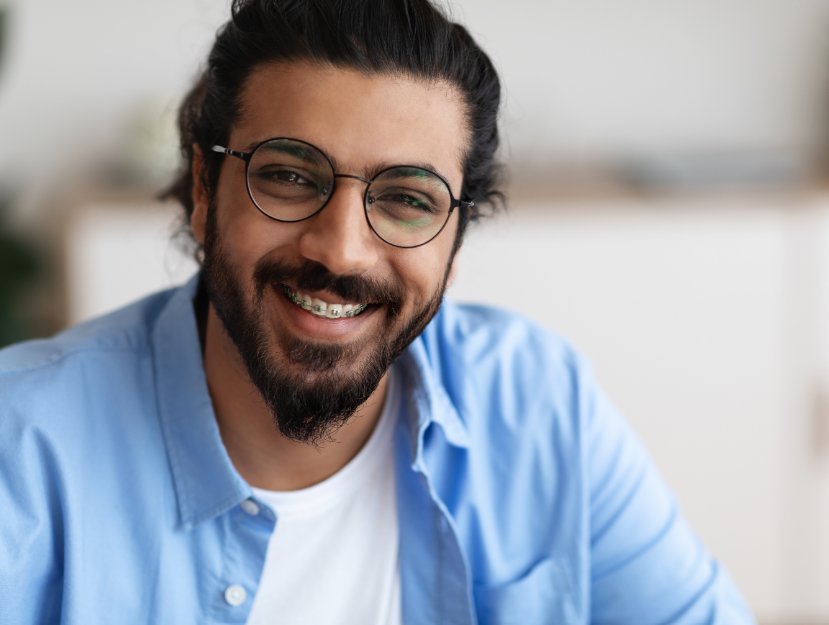Man with braces, smiling