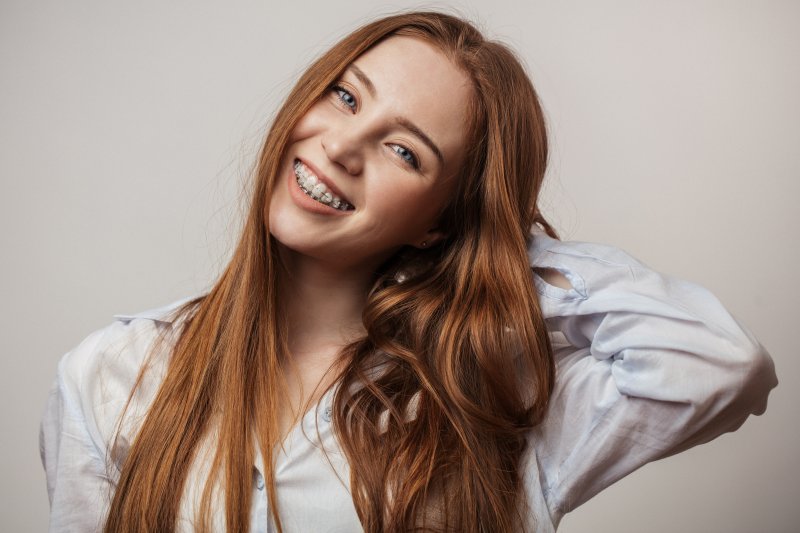 Teenager smiles at viewer