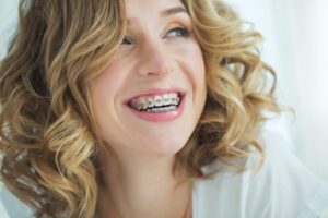 Woman with braces smiling